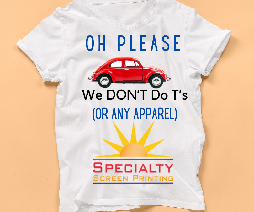 A white t-shirt on beige background displays a volkswagen beetle and the phrase "Oh Please, we don't do T's or any apparel" followed by the specialty screen print logo